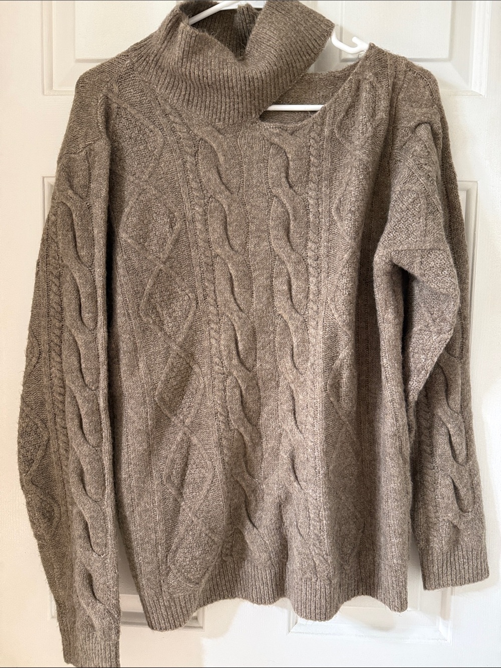 Cozy Cable-Knit Turtleneck Sweater in Taupe with cutout